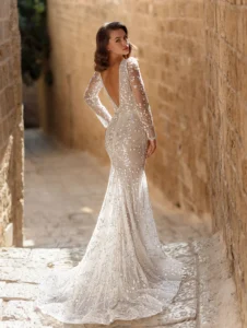 Model wearing Brooke bridal gown by Adi Shlomo Bridal, full back view