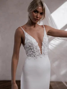 Model wearing Cameron Crepe bridal gown by Made With Love bridal dresses (front closeup view)