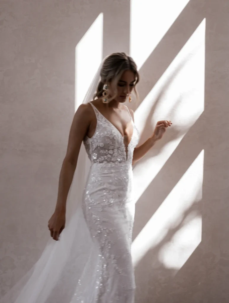 Model wearing Cameron bridal gown by Made With Love bridal dresses (3/4 front view)