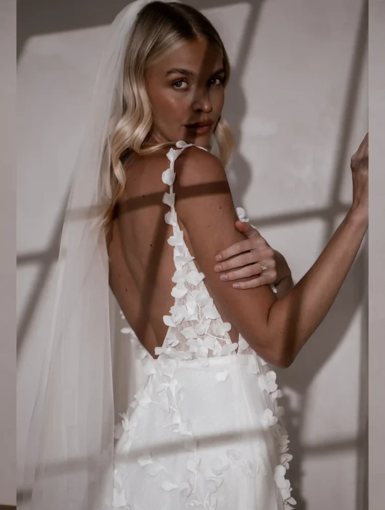Model wearing Cooper bridal gown by Made With Love bridal dresses (closeup back view)