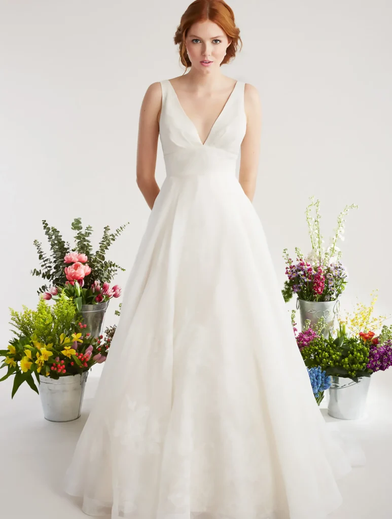 Jacaranda bridal gown by Lea Ann Belter Size 10 on bridal model with floral buckets