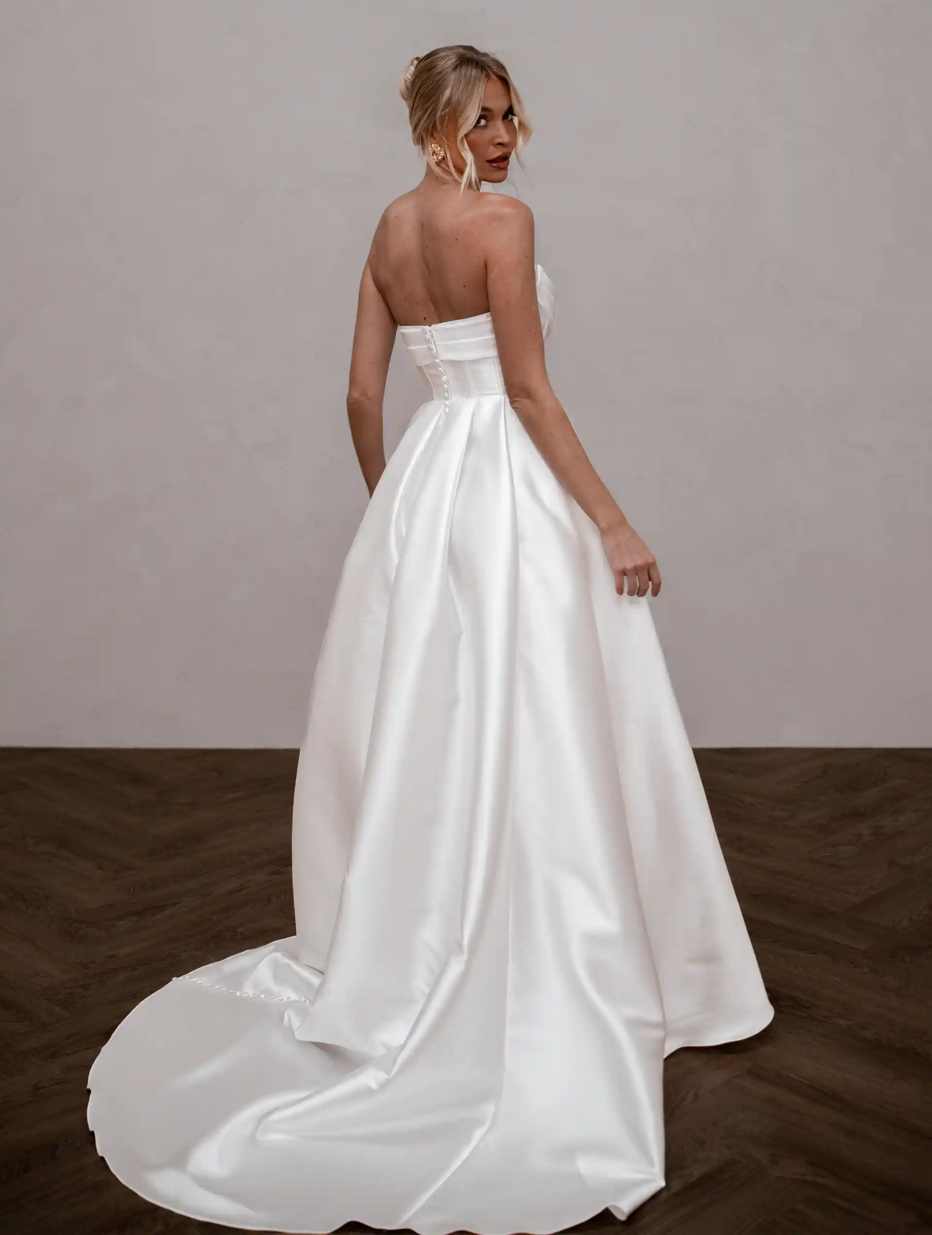 Model wearing Celine wedding bridal gown by Made With Love bridal full back view dress
