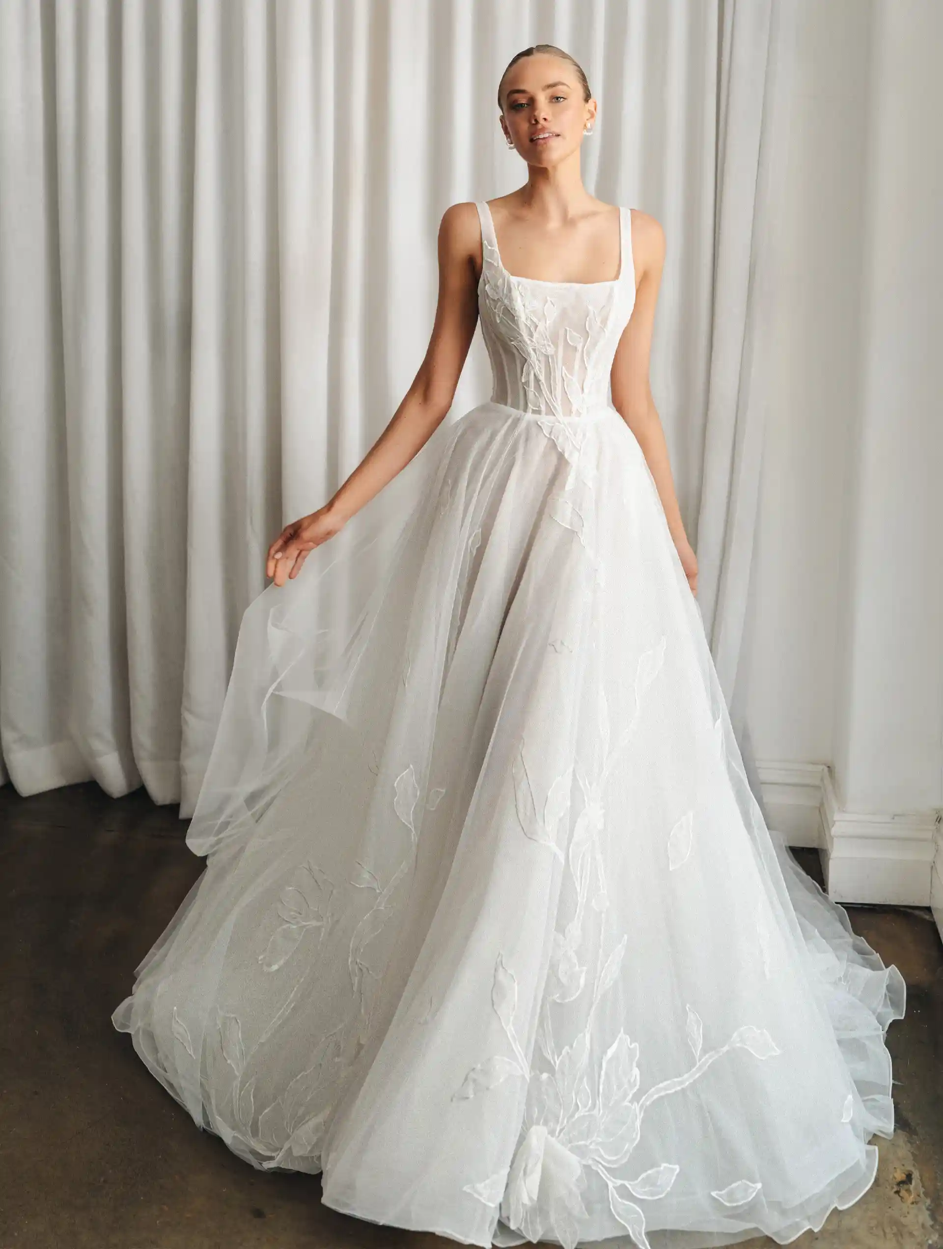 Model wearing the Kayla gown by La Premiere Bridal full front view