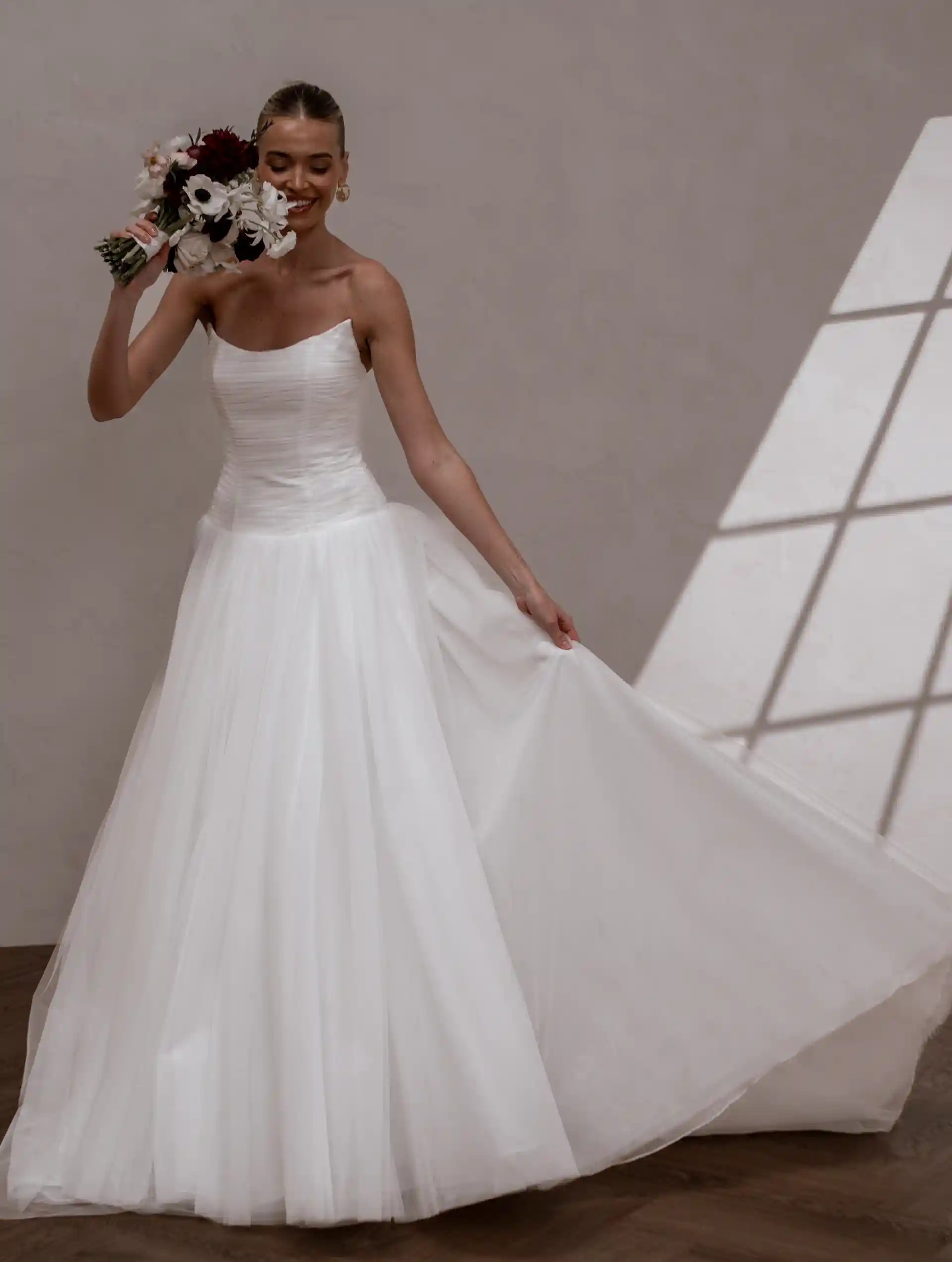Model wearing Aire by Made With Love bridal gowns full front view