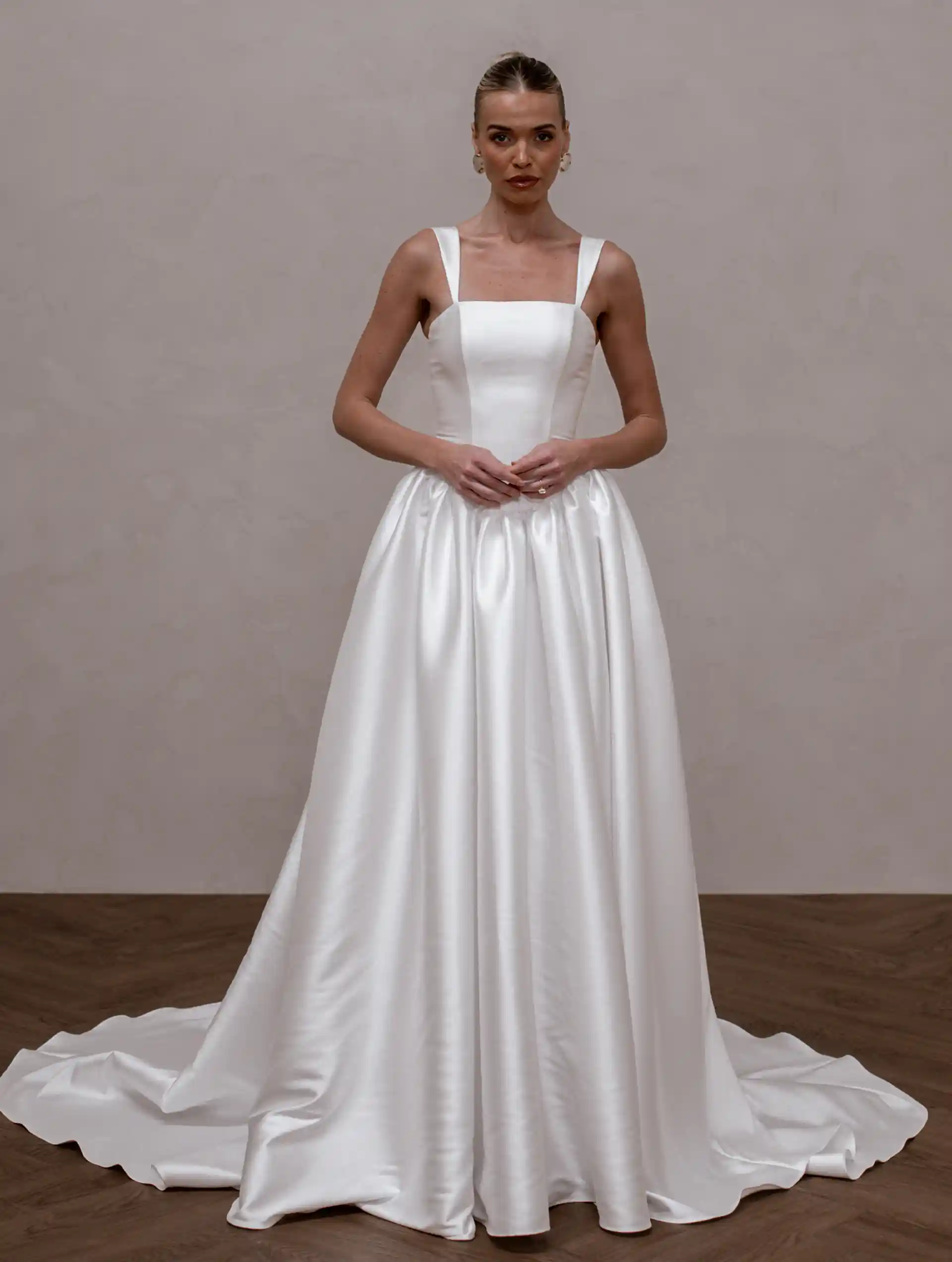 Model wearing Raine by Made With Love bridal gowns full front view