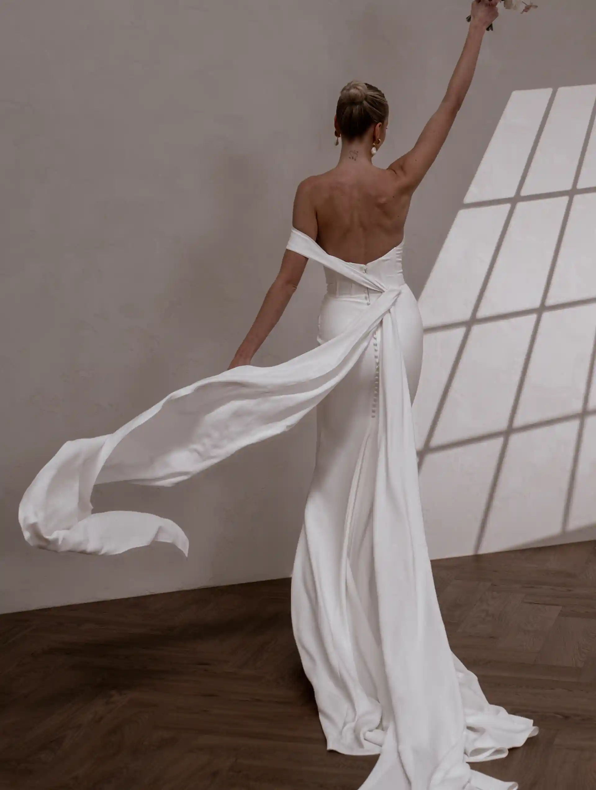 Model wearing Made With Love bridal gown Rhode by MWL full back view
