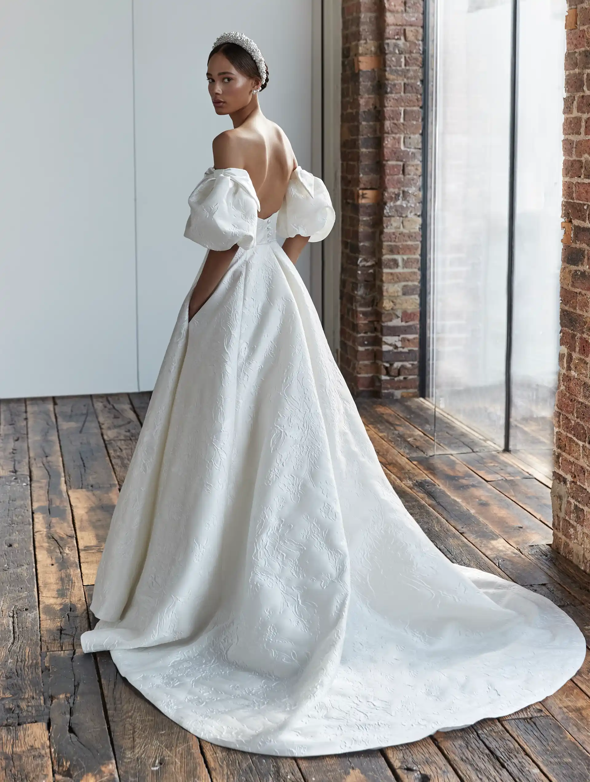 Stephanie-and-sleeves-Gown-by-Sassi-Holford-Bridal-Full-Back-View.webp